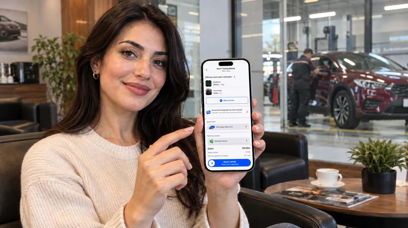 Illustration: a woman showing the Yumo booking screen on a phone in a car service waiting area
